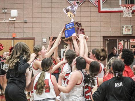 Beaverton’s Trinity Danielak launches another 3-pointer during Friday night’s victory over Gladwin. The freshman made six and led all scorers with 29 points as the Beavers grabbed the Cedar Cup (inset).