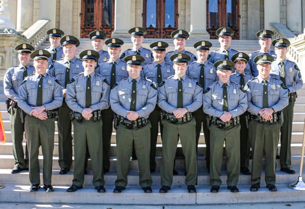 Pictured with command staff from the Michigan DNR Law Enforcement Division, 12 new conservation officers graduated from the 12th Conservation Officer Training Academy, Thursday, Nov. 9, in Lansing. The officers were hired as probationary COs who were already licensed law enforcement officers in Michigan and previously served different communities. The 10-week academy focused on fish, game and recreational laws, rules and regulations specific to natural resources.