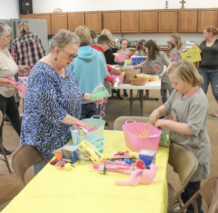 Adults helped Kid’s Club kids build the Easter baskets.