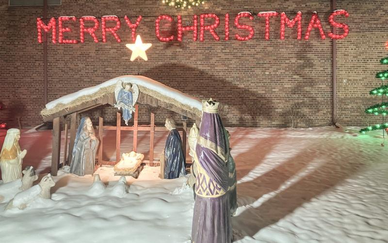 A ceremony lighting a manger scene in front of the Beaverton Activity Center building.