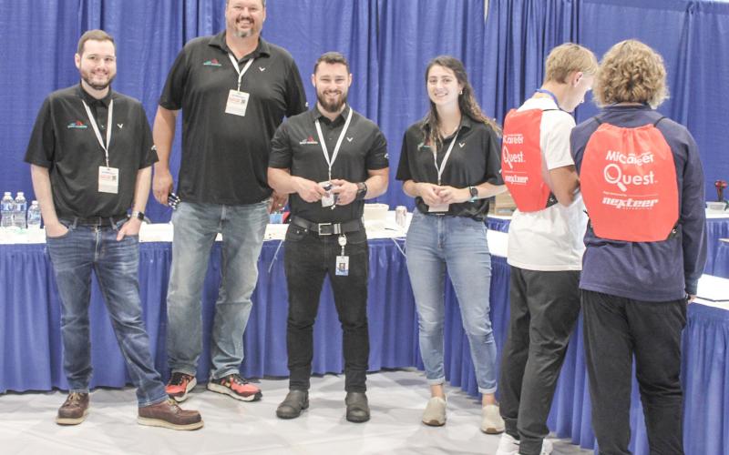 High School sophomores from Gladwin County will have the chance to interact with more than 70 employers at the 2024 MiCareerQuest Middle Michigan event. Pictured here at last year’s event are representatives from Saint-Gobain in Beaverton.
