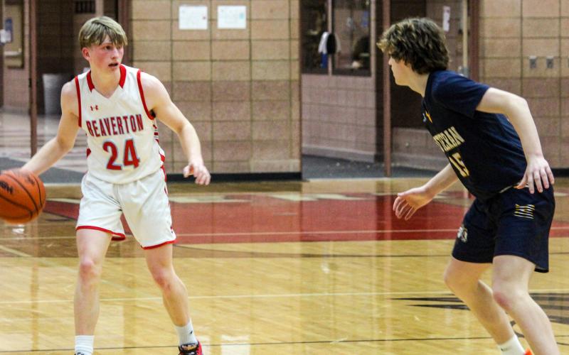 Senior George Killian takes the ball pass midcourt and into opponent territory.