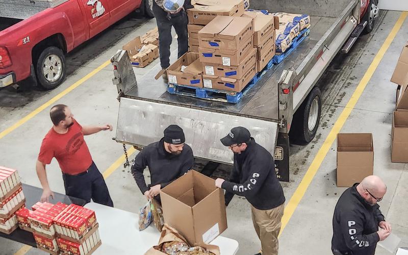 Volunteers at the seventh annual Thanksgiving Dinner Giveaway event at the Beaverton Area Fire Department.