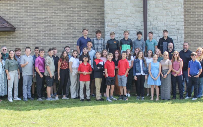 Mayor Sarah Kile, Skeels staff, and students line up outside of Gladwin Free Methodist Church on first day of school.