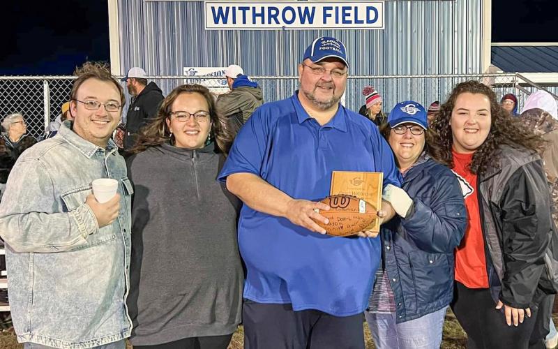 Pastor Withrow and his family on the newly named Withrow Field.
