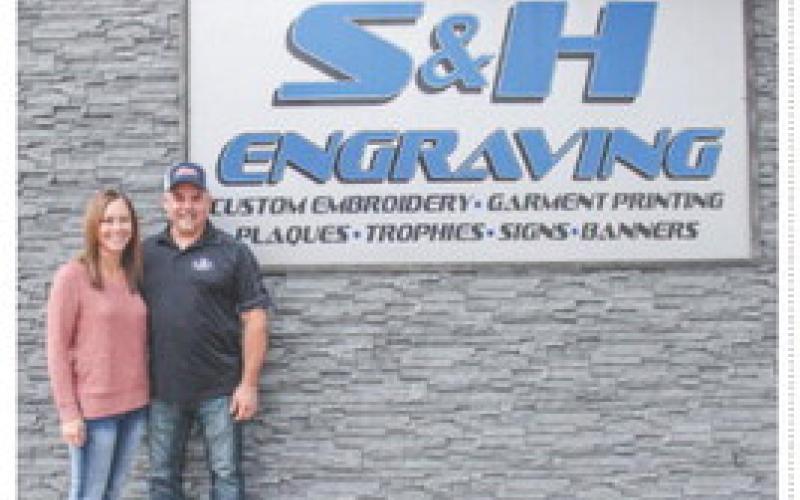 Mike and Stephanie Hess pictured in front of S&amp;amp;H Engraving located at 202 E. Cedar Avenue in Gladwin.