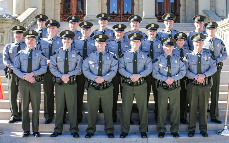 Pictured with command staff from the Michigan DNR Law Enforcement Division, 12 new conservation officers graduated from the 12th Conservation Officer Training Academy, Thursday, Nov. 9, in Lansing. The officers were hired as probationary COs who were already licensed law enforcement officers in Michigan and previously served different communities. The 10-week academy focused on fish, game and recreational laws, rules and regulations specific to natural resources.