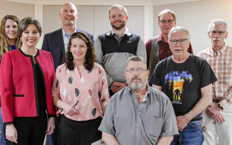Members of the Gladwin Chamber of Commerce stand alongside speakers from Friday’s event including Beaverton Mayor Ray Nau, Gladwin City Manager, Chris Shannon, Gladwin Airport Manager Mike Hargrave, Trail of Two Cities Coordinator Mike Ridley, and Congressman John Moolenaar.