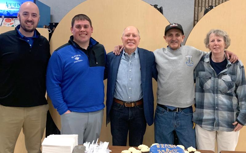 Pictured left to right are: current football coach, Marc Jarstfer; defensive coach; Kody Emeott, Mike Bailey, Kenny Owens, and Ruth Ann Joslin.
