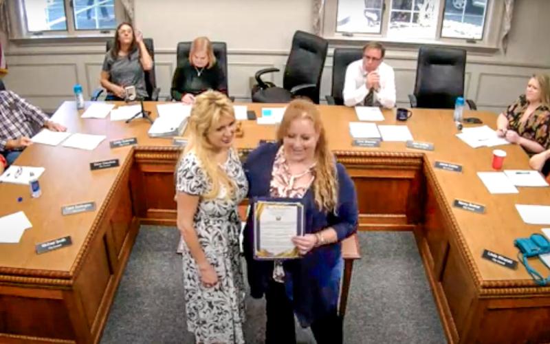 Mayor Sarah Kile (right) presented a proclamation to Lisa Kujawa (left) of Golden Key Camp at a Gladwin City Council meeting on Monday, October 21. YOUTUBE: CITY OF GLADWIN