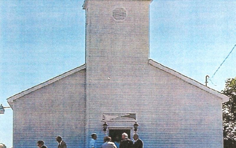 Pictured is the present day Hockaday Community Church. Inset photo is the church during its 100 year anniversary.