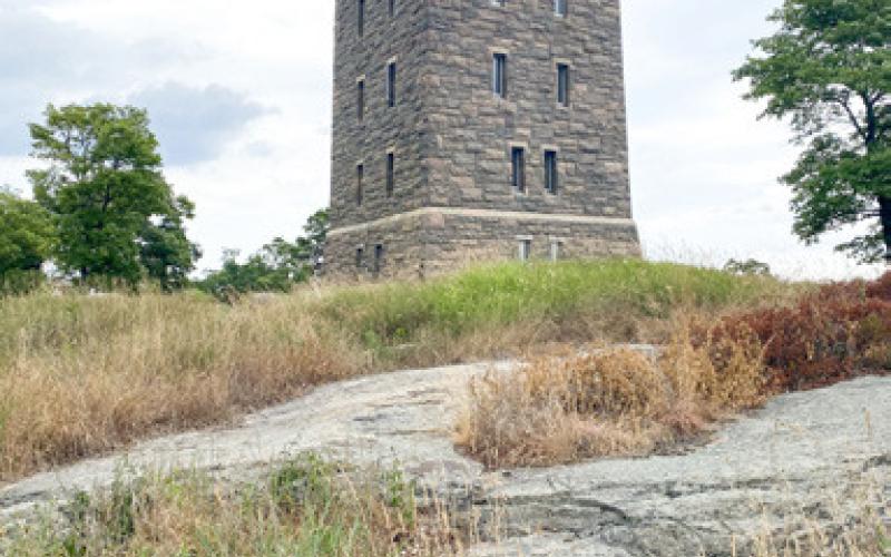 Steep trail that leads to the top of Bear Mountain. Inset photo, the George Walbridge Perkins Tower sits at the top of Bear Mountain and was constructed in 1934.