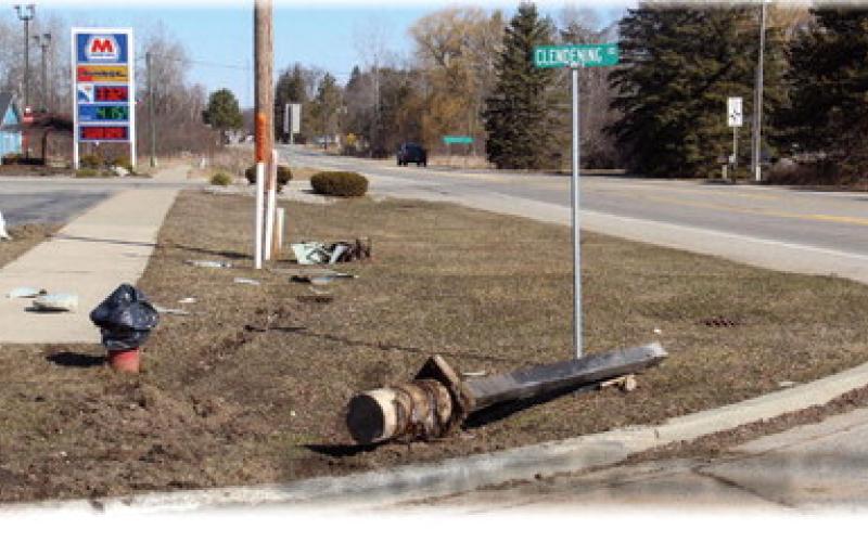 Damage caused by Cadillac driver on the corner of Clendening Road and M-18 at the Sunrise Marathon Station.