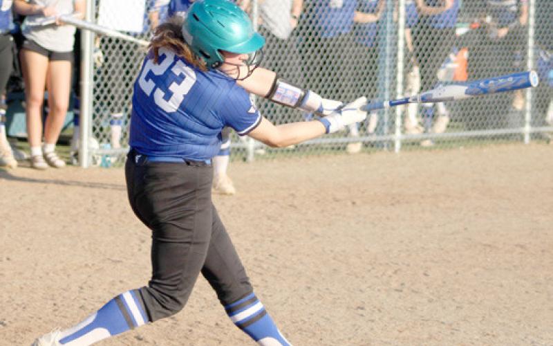 Gladwin’s AvaKay Hilts smacks one during a game earlier this season. The Flying G’s split two doubleheaders last week.