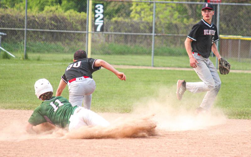 Beaverton shortstop Reese Longstreth backs up second baseman Caiden Loar as Clare tries to steal second base.