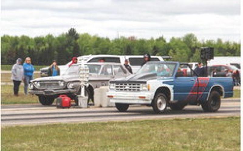 Racers put their pedal to the metal as they are signaled to start.