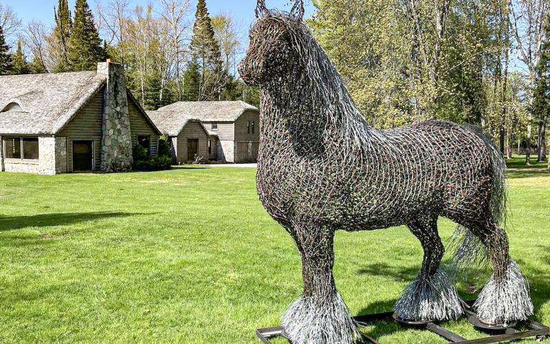 Jeff’s recently made horse sculpture stands at the entrance to Tobacco Ranch in Clare County. Inset photo: Jeff’s leprechaun statue for Clare’s Irish Festival.