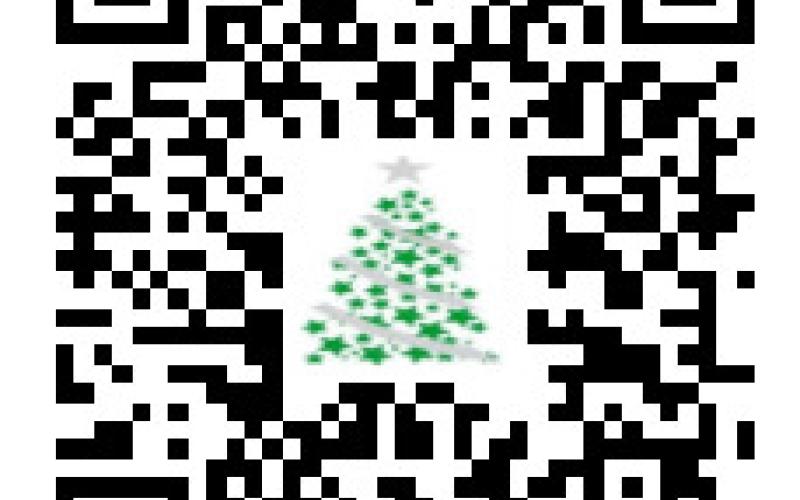 Ed and Gail Wistey are pictured placing Christmas Kindness Donation cans in 35 locations in Gladwin County. Inset is the QR code to make a donation.