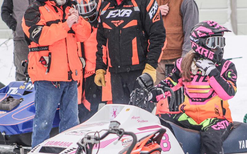 Engines rev as the next heat waits for the signal to head onto the track at the Vintage Snowmobile Race held Saturday at the Gladwin County Fairgrounds.