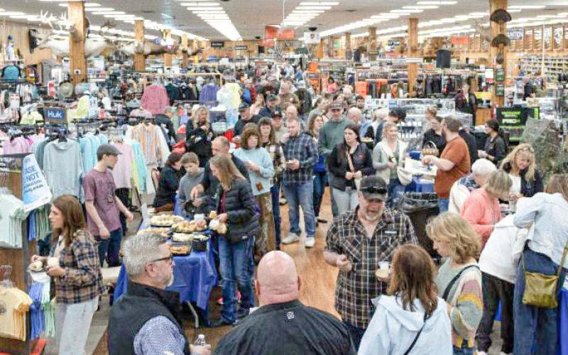 Crowd of people inside Jays Sporting Goods for A Northern Tradition event.