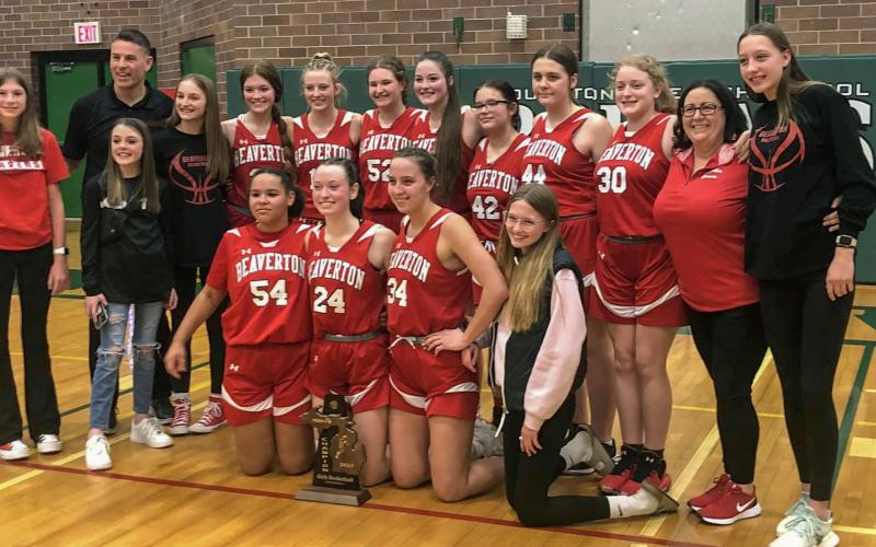 The Lady Beavers after defeating Houghton Lake at the District Finals on Friday night. PHOTO PROVIDED BY MARTIN MICHAEL HODGE