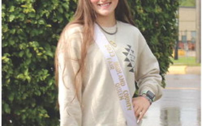 Taylor Bonham wearing her crown and sash she acquired for winning the Queens Contest at the Midland County Fair.