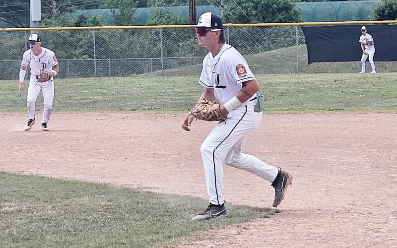 Linwood’s First Baseman Kaden Gerzseny moves in on a bunt attempt as Dane Alexander, second baseman moves over to cover first base and Brody Riedlinger defends right field. Inset photo, Linwood’s Brady Bowen delivers a 2-seam fastball.