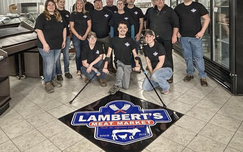 Employees at Lambert’s Meat Market prepare for the soft opening on Wednesday, April 24 and the grand opening at 8 a.m. on Monday April 29.