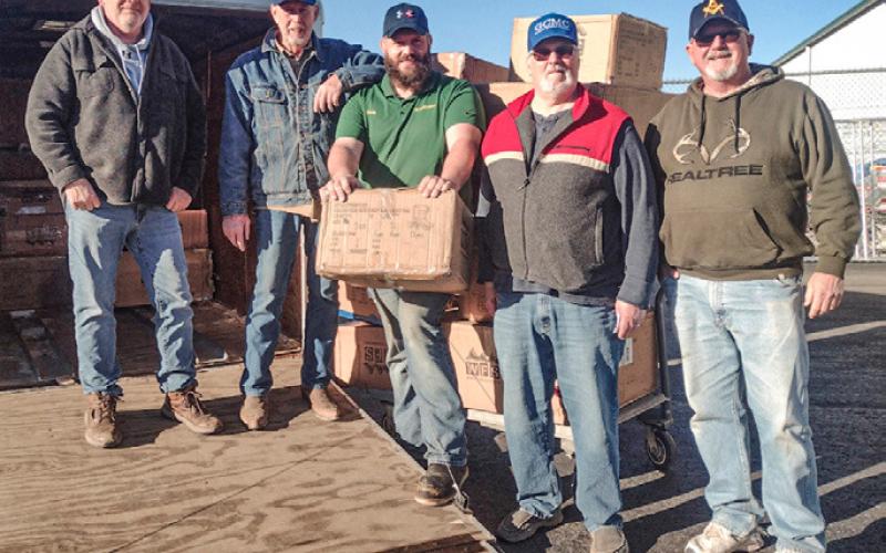 The Gladwin Christian Men’s Club Picking up 2024 boot order at Family Farm &amp;amp; Home.