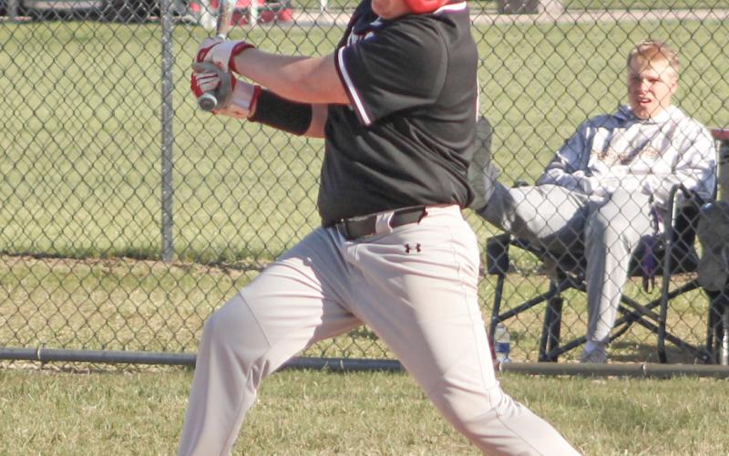 Beaverton’s Cameron Oard fouls one off during last week’s doubleheader with visiting Standish.