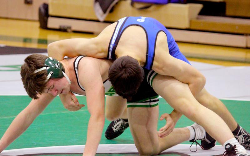Gladwin looks to wrap up his Clare opponent for the win.