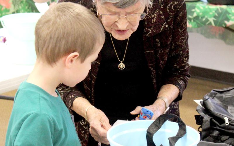 Members of the Christ the King Lutheran Church and the Kidz Club gathered last Tuesday to prepare gift baskets that will be distributed to foster children in Gladwin County.