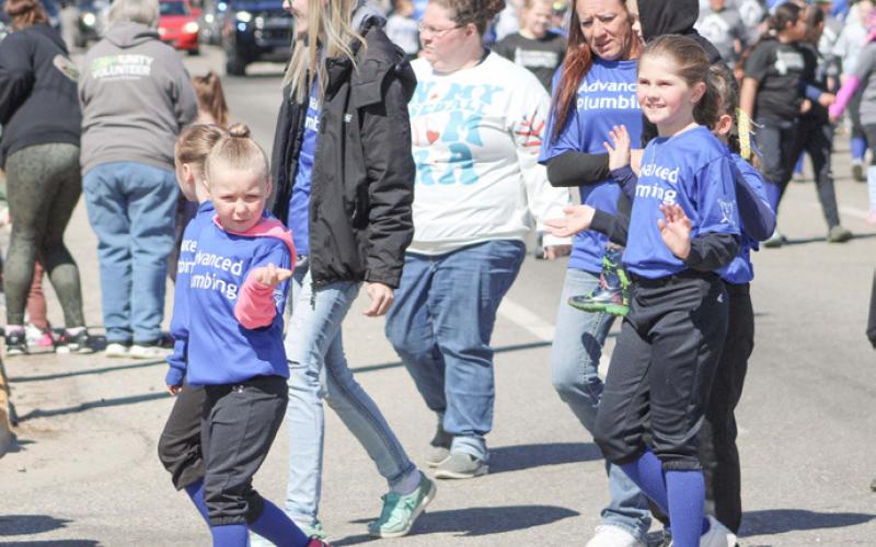OPENING DAY PARADE FILLS THE STREET