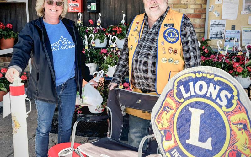 Pictured is Sandy Dollen, with Lions Club member, Mike Stroman, during the White Cane fund drive.