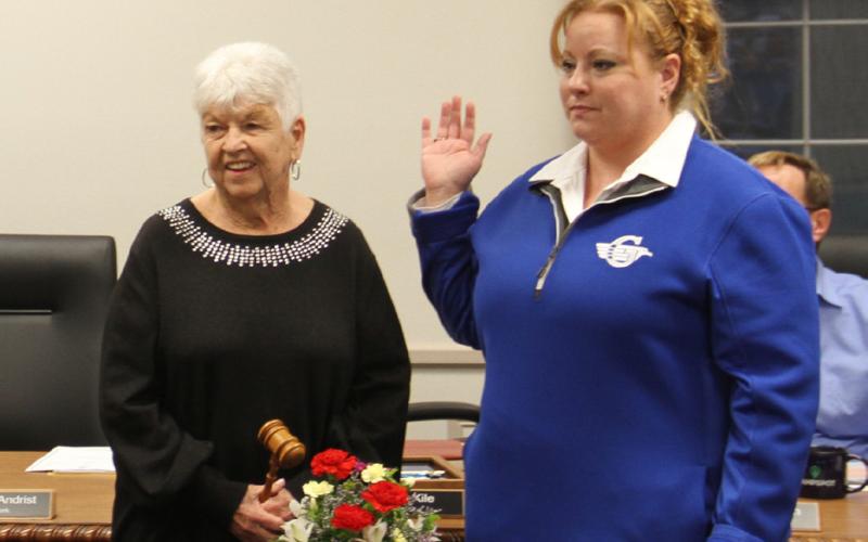 Sarah Kile (right) is sworn in as the new Gladwin City Mayor. She stands with former Mayor, Dee Jungman who awaits the passing of the gavel.