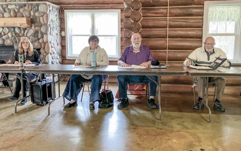 County Commissioners (left to right) Karen Moore, Tami O’Donnell, Mike Visnaw and Tom Winarski open their Regular Meeting Tuesday, which was relocated to The Lodge at the Gladwin County Recreation Area.