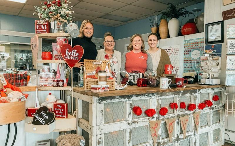 Pictured from left to right: Kennedy Cripps, Kim Shea, Amy Dull and Clarity Gerow. These four women pose together at the front counter of Flower Scents to announce the business ownership change on Valentine’s Day (Feb. 14).