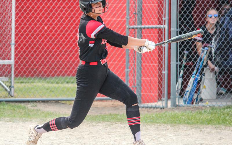 Faith Danielak takes a swing at the ball.