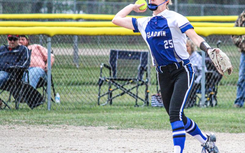 Tessa Cameron throws to first after scooping up the ground ball. Inset photo, Beaverton gets a good swing and looks to send the ball in play.