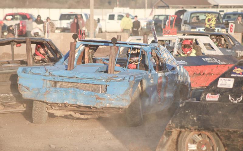 Max Holmes III of Beaverton fights his way through the traffic during the Figure 8 race Saturday at the Gladwin County Fairgrounds.