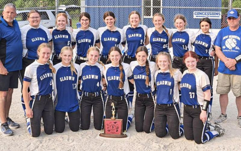 Team picture of the 2023 Lady G’s with the Jack Pine trophy after winning their second consecutive conference title.