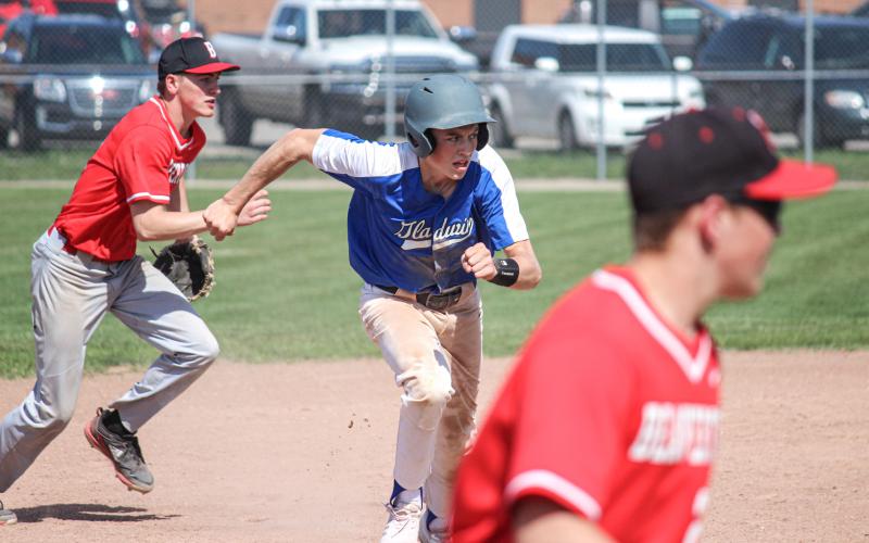 Gladwin keeps an eye on home plate as he runs to third.