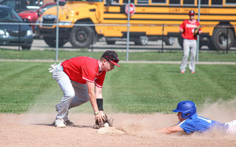 Gladwin slides headfirst, looking to steal second base.