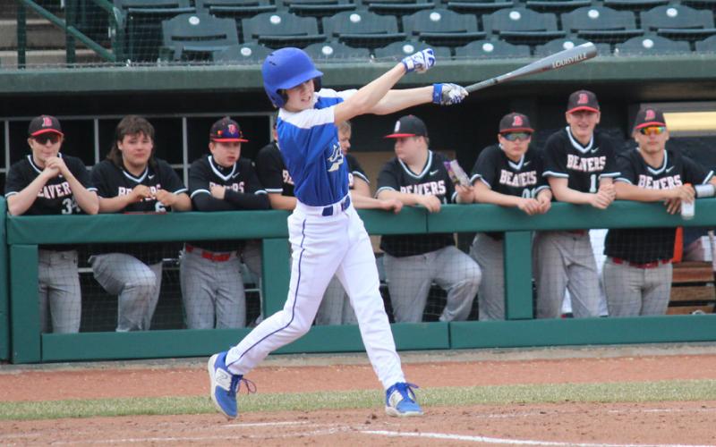 Gladwin takes a swing at the ball.
