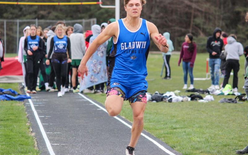 Flying G’s approach the sandbox during the long jump event.