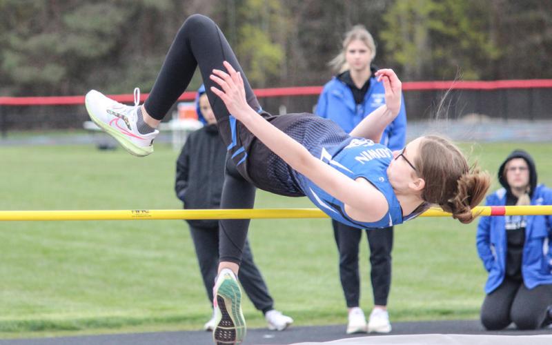Lady G’s clear the pole during Wednesday’s high jump event.