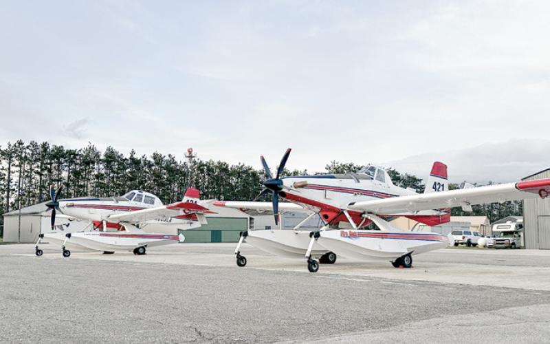 These planes – Air Tractor AT-802 models modified to scoop water for wildland firefighting – are flying for the DNR during the spring fire season.