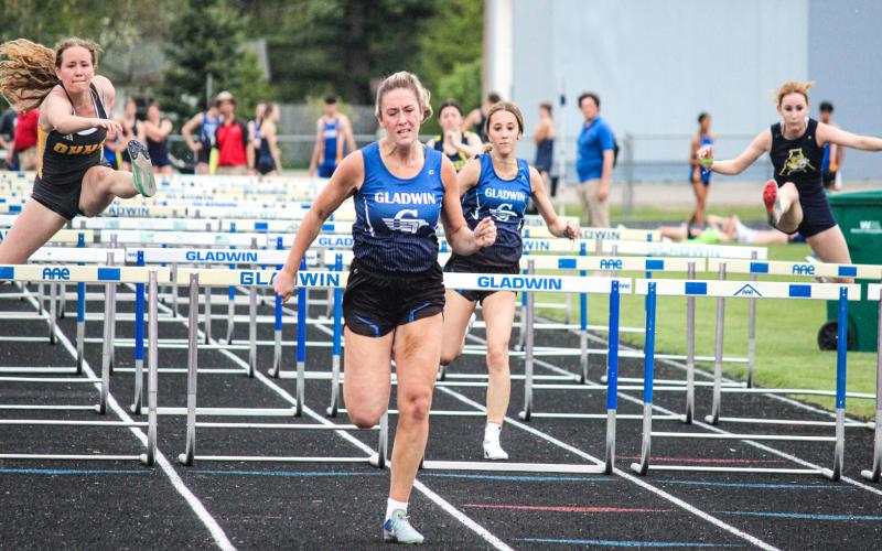 Lizzie Haines sprinting to the finish during the May 12 Legends Meet in Gladwin. Haines qualified for State Finals on Friday night in both the 100 and 300-meter hurdles.