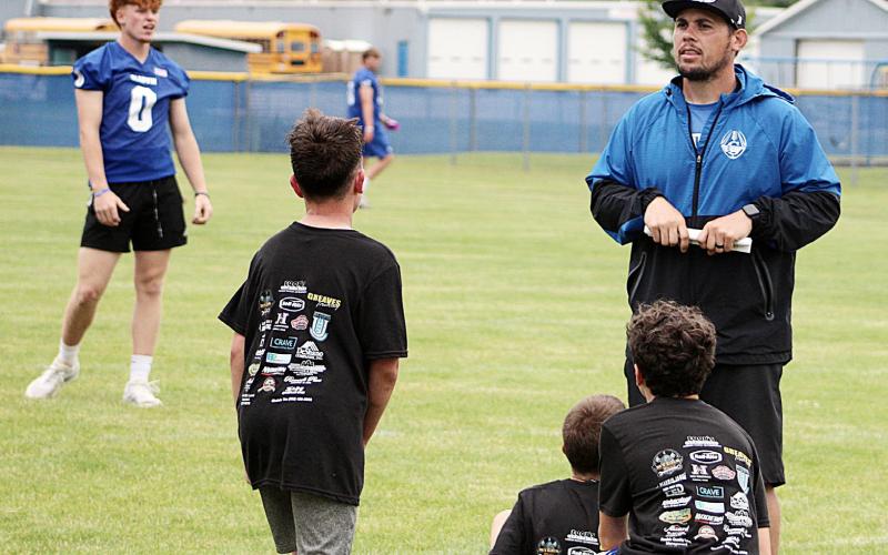 Gladwin coach Kody Emeott gives out directions last Wednesday at the Tim Foor Youth Character and FUNdamentals football camp.