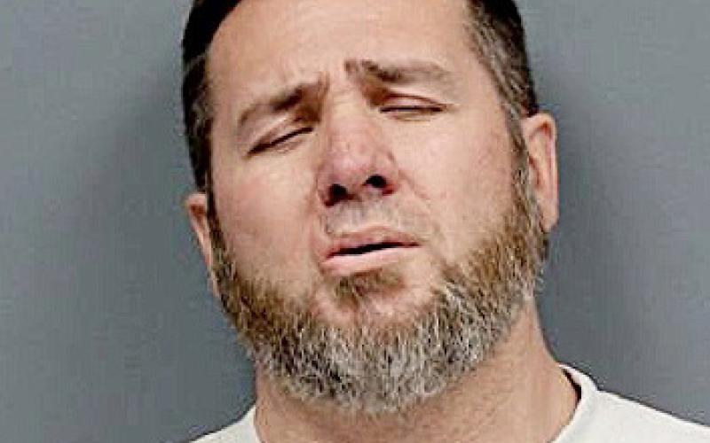 Gasoline assault leads to arrest